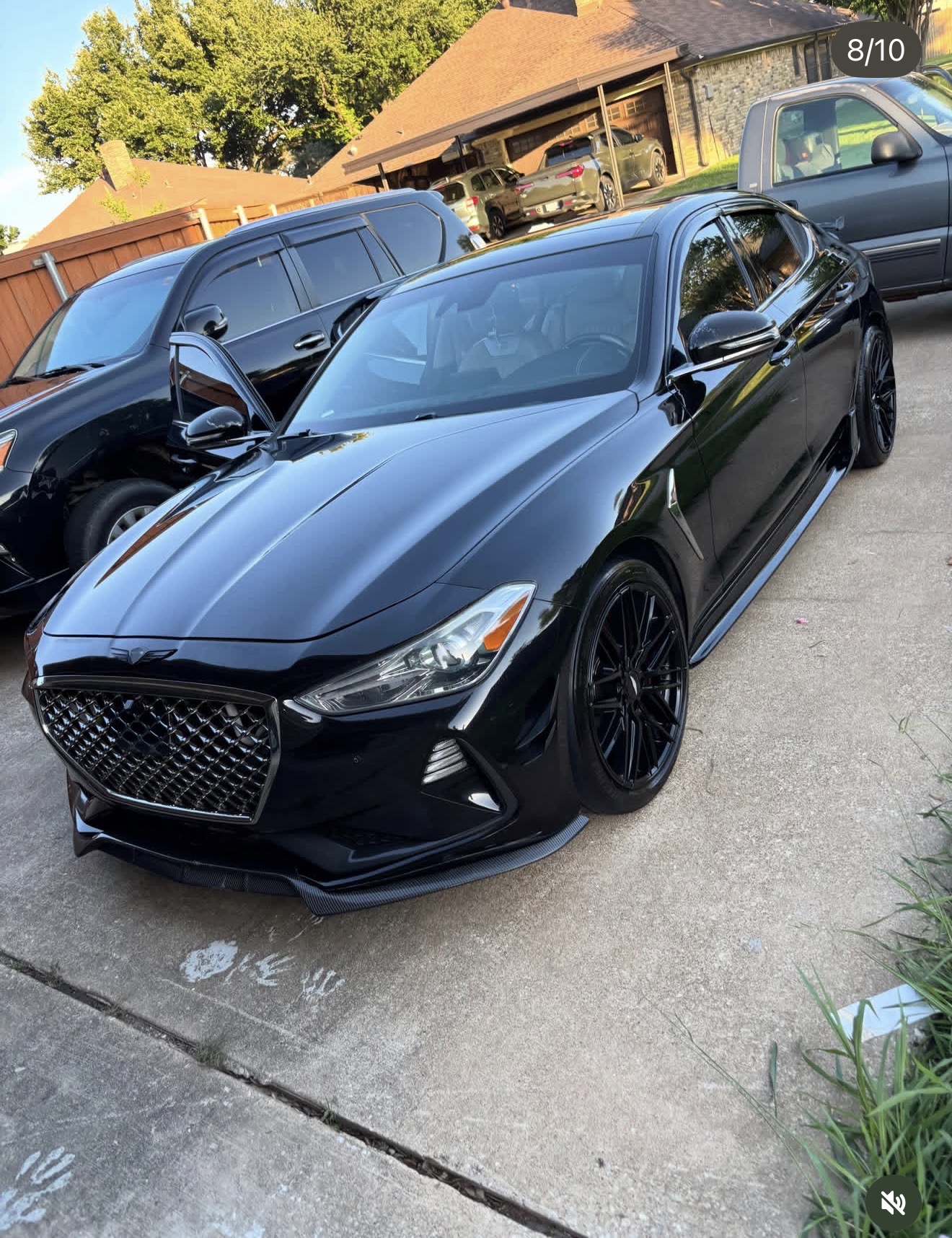 Glossy black Genesis after a full detail