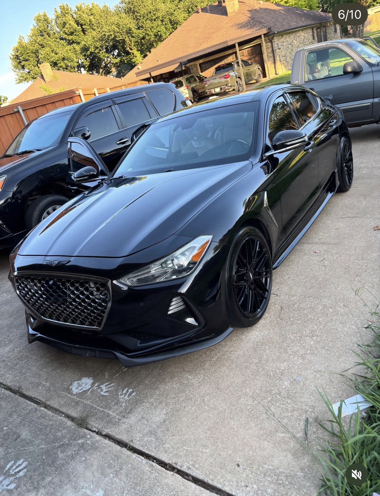 Glossy black Genesis after a professional detail